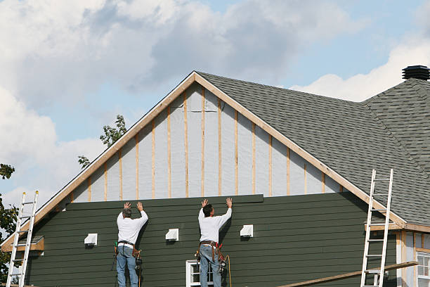 Professional Storm Damage Siding Repair technician working in Home, WA